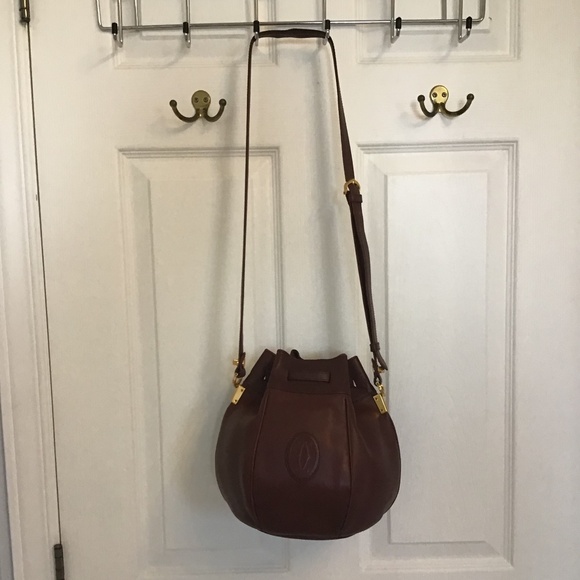 Iconic Cartier leather bucket shoulder bag with dust cover. - Picture 1 of 10